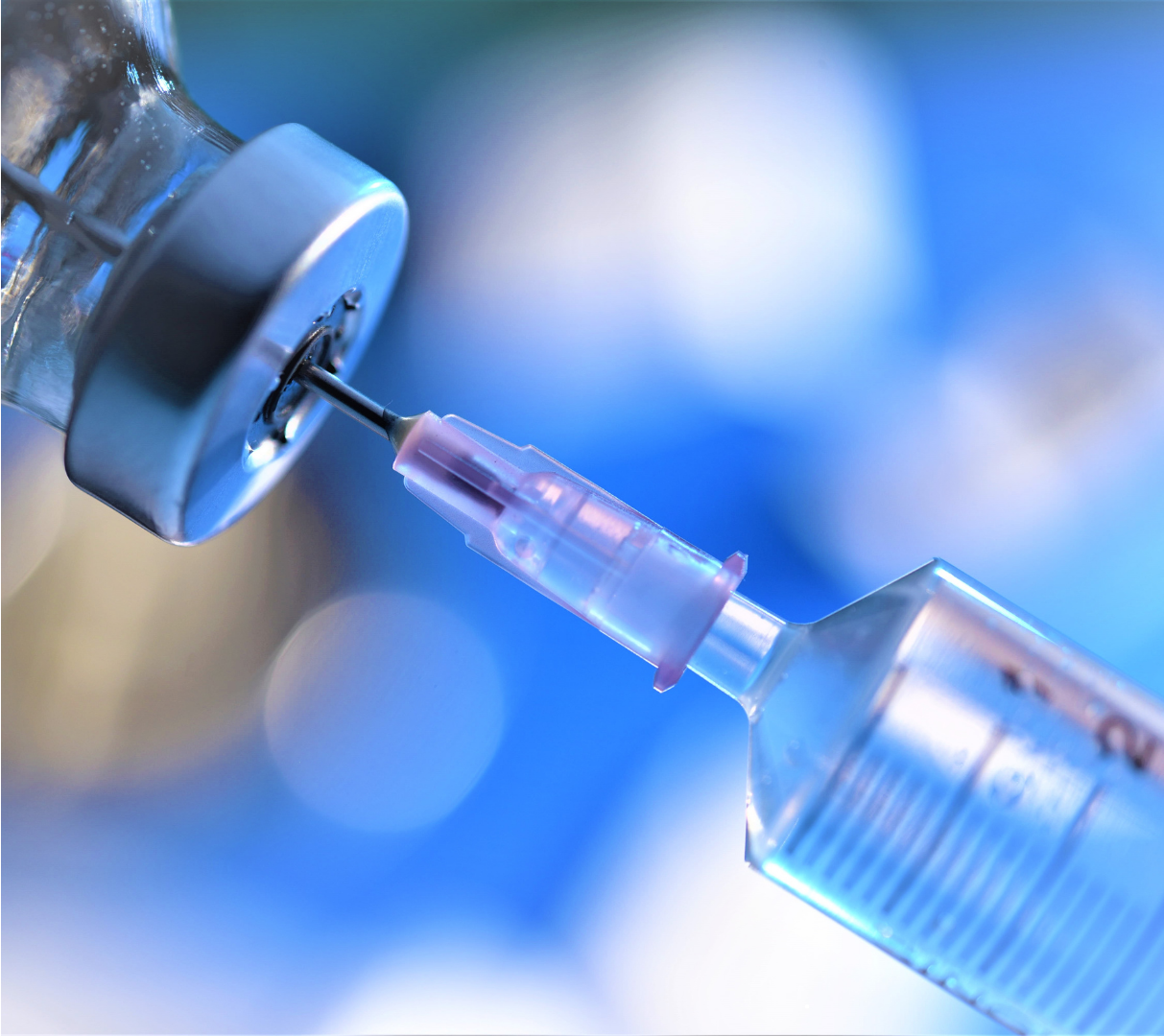Syringe inserted into a vial